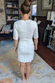 I love the structured details of this dress, but the size just didn't work even though I'm a small in other Lulus dresses. I'm a little curvy and this dress required putting it on over my arms. I felt a little 'poured into' this dress and I'm feeling great and slimmer than ever = For reference, I don't have a bra on here and my chest is not large to begin with. - Randi N.