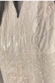 Dress was beautiful, the shoulders would need to be fixed a little so that I could have the fit I want. Also the dress is heavily embroidered than shown in my opinion. I was just looking for something a bit more subtle I added pics to see the detail. - Endesia M.