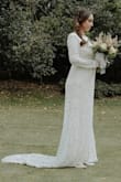 The dress is so beautiful, I got many compliments (and people can´t even imagine I bought it online and for the price). I was hesitant to order my wedding dress online while pregnant (because I didn´t know what I would actually measure in my wedding), but it turned out great! Pre-pregnancy I'm usually 5'4 and 120 Lbs. I spoke to the Bridal team at Lulus, and they suggested I order a size large (I'm usually a Medium. I believe if I hadn´t been pregnant, my usual size would have been perfect. As it was, I had to alter the dress a bit (had the sleeves narrowed and hemmed a little), but my midsection was perfect fit perfectly and looked pretty great (the baby didn´t even show that much). The other alteration was adding a tiny button in the back to pick up the train and not step on when dancing.
The dress is comfortable, flattering; the fabric and lace are beautiful, it works well for a fall or winter wedding.
I loved it, and I can't believe I got away with getting such a bargain for my wedding! - Maria C.