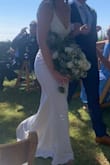 I ordered this dress for my small backyard wedding. I got a small at first, but returned for an xs. I did still have to get it tailored to fit just right, but for any other event it would have been fine as is! It does run long, so the length is great if you're tall. I also had my tailor remove the adjustable straps to make the dress look "nicer" since it was my wedding dress. It came out AMAZING. I got so many compliments and no one would have ever guessed it was from Lulus. I spent more on tailoring to get the dress the perfect fit than I did on the actual dress, but it was 100% worth it.
I did have to use dress tape at the top since it is fairly low cut, but I had planned for this and it worked perfectly. Everything stayed in place the for the entire event! - Danielle W.