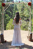 I absolutely LOVE this dress. It was perfect for my wedding day. I had a dream of a lace long sleeve dress and was disappointed that most were too modest, covering the entire chest area. This was PERFECT in showing a bit of skin but still being classy and beautiful. I typically wear a size S or XS, but the XS was too baggy on me. To my surprise, the XXS fit like a glove and showed off all the right curves. I did have to get it hemmed but that's only because I didn't wear heels. All in all, this was my dream dress and I highly recommend. - Gabrielle D.