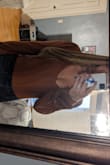 Have this in green too. I love this orange shade it's perfect for fall. Paired also with vegan leather jacket from lulus for perfect fall look. Two buttons that snap securely on bottom, also doesn't ride up your back side. Highly recommend. - Jackie M.