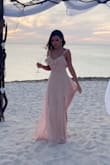 Got this dress for a beach wedding and it was perfect! Got tons of compliments. I'm a 5'8" and 143 pounds and it was slightly loose , but it was perfect, because it was hot and you don't your dress to be tight. - Anastasia B.