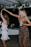 I got this dress to wear after my reception and it was so much fun to dance in! I did get it slightly altered by adding cups and taking it in a little around the chest. I was really happy with the quality of this dress! - Krista L.