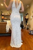 I have a long torso, so usually fitted dresses don't work well for me. This dress is made of a very stretchy fabric, so it actually conforms really well to whatever your body shape is. - Amber K.