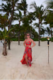 I bought this dress for my five year wedding anniversary in Mexico. It is absolutely stunning. When we were walking through our resort for our dinner on the beach, the other guests were all staring & commenting on how great my dress was. My husband also loves it! Like the other reviews mention, it's very long & it will need to be hemmed (just didn't have time to have that done before the trip). I am 5'5 & was wearing 4" heels but it was still dragging on the ground if I didn't carry the skirt. I think it's nice though that it is designed to be floor length for taller folks too & those of us who are short like me can just have it hemmed. - Emma B.