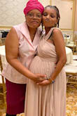 I was looking for a somewhat loose fitting piece in the stomach area that could fit around my belly. I don't like buying maternity clothes so I always buy a size up. I'm very short so I had to get the dress hemmed. The dress itself was soooooo beautiful! I felt beautiful wearing it! The material is great and well made. - Danielle L.