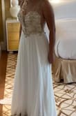I highly recommend this dress. The top part fit perfect because you can tie it tight in the back. I just needed to get it hemmed because I am short. It's way more gorgeous in person. - Christina C.