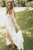 Found this site through a FB group by men, was a little skeptical at first but after looking through all of the dresses I fell in love with this one. But I was nervous it wouldn't fit right I would look right but I still ended up buying it. It arrived fairly quick, I tried it on it was a little snug but fit perfectly in all of the right places thankfully. My post will not let me tag my way I am about 165 pounds in about 5'7" The stress was perfect for my out-of-state elopement. I was able to easily roll it to fit into my suitcase. It was also very light and airy perfect for the extremely hot day it was. I had so many compliments. Keep in mind it is a nude bodysuit with lace overlay. My butt did show a little bit but I was able to find some nude Shapeware that came a little bit over that would help cover. I am also a size 36B bra my chest area was a little bit loose as far as the dress goes. But I was able to find a bra on Amazon that was cut perfectly to help pad it. But either way I highly recommend! - Kennedy F.