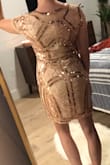 I love this dress! I bought it in a Small and Medium and am opting for the medium. It's not perfectly tailored like a glove, but it is tight enough and the pattern does the rest to define and enhance my body shape. I love a statement dress and never want to wear something simple or boring to big event or night out. This is perfect because the neck line and sleeves keep it classy and balance the sequins and sparkle. Absolutely perfect. - Cargo S.