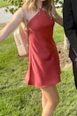 The dress fit well through the chest and waist. It was short and because of the color and material, she wasn't able to wear shorts underneath. - Meggan S.