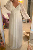 This dress was incredibly comfortable & flattering for my newly pregnant body! I wore it for our post-wedding party, a year after our small wedding (due to COVID) at our family's farm. It was perfect for the chilly night. I also appreciated that it was form-fitting in the bust, and very loose from the bust down. At the time I was only about 13wks pregnant so I didn't have a massive baby bump yet, but I was definitely bloated & heavier than usual. It was also the perfect length for my tall frame.

The dress got very dirty from walking around outside the entire day, but my mom soaked it in cold water with bleach & detergent first, then put it in a bag in the washing machine on VERY HOT and a HEAVY DUTY cycle (using CAR WASH SOLUTION, LOL) and it cleaned perfectly; you can't tell at all how dirty it was before! I highly doubt that it was recommended to wash it that way but the dress held up perfectly!

The only complaint I have is that the dress lace did easily snag on things. When it snags, it gets fluffy/fuzzy. - Nicole P.