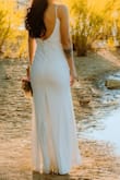I originally ordered a small which did fit well but returned because I wanted the dress to be a little tighter/form-fitting. I LOVED the way the XS fit. The material is really nice, thicker, and has stretch to it. I didn't need to tailor for length either, the dress was the perfect length for me with heels on. - Heather S.