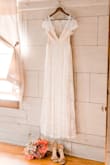 This dress is so beautiful. This was absolutely my dream dress and I ordered the last one that was in stock in my size. When I received the dress it had a very tiny tear. I called customer service to ask for a refund since I could not exchange it and expected to have to put up a fight to get some money back. But the customer service representative was wonderful and understanding. They immediately gave me a very generous partial refund so that I could have the dress repaired and also gave my a coupon for my next purchase. Overall I am very pleased with the dress and the company! - Serenity T.