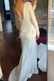 Pros: 
- It fits perfectly and it hugs all the right areas (note that the dress will accentuate areas of the body. I'm 10 months postpartum and have a bit of a belly. I'm also wearing shapewear under the dress to help smooth everything out)
- I like that it's not too long that I'm going to trip and die while walking down the aisle, and love the back of the dress and how has a bit of a train. 
- I have a half sleeve tattoo, and the sleeves are not too thin that it sees through in daylight and that made me happy as I am looking to cover it up for my wedding. 
Cons:
- The quality could do a little better, but it's dress under $200 so I'm not asking too much of it. I didn't like that I can see the built in bra padding, but it's not super obvious so I'm fine with it. 

Overall it's a great dress that I am happy to wear on my big day! - Donya D.