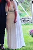 I wanted a dress that was:
-inexpensive
-comfortable
-warm enough for an outdoor fall wedding
-not princessy
-flattering on my short and wide frame
This dress did it all!
I did have it altered - I shortened the hem and removed the train, tightened up the arms and bodice, and shortened the sleeves to just above the elbow. I think this all helped to make it look more modern.
It does have a zip all the way up the back, but the way it hangs from high on the waist means you still have a great range of motion. I could sit and move easily, and while it was form fitting, I never felt like I was *sewn into it.*
There are hardly any reviews of this dress, maybe because it looks a little old fashioned in the picture. But if you're short and wide like me, skip the mermaid dress (I tried on SO many mermaid dresses that didn't fit me right at all) and give this one a shot. - Elizabeth B.