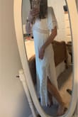 I'm so in love with this dress!! I never purchase much clothing online, let alone a wedding dress without trying it on first! But this dress felt like it was made for me. I ordered an XXS due to my usual size of XS being out of stock. I was really worried it would be too small but it even has a little wiggle room in the bust. I read reviews about going down a size from what you usually wear, and I'm so happy I did. Pictures don't do this dress justice, I was surprised at the weight of it (in a good way!) it's very high quality material. The length is perfect, no alterations needed. I'm very small in the chest, no bra was worn in the pics. Easily can be worn with or without one. - Kristyn F.