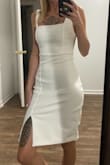 I feel like the photo isn't an accurate depiction of the fabric. It was HUGE on me and I had to have it altered. Also, it wrinkles incredibly easily. I had a 12 minute drive and the back was very wrinkled when I arrived at my event. - Steph S.