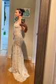 I loved this dress! The only reason I didn't go with this one is because I'd prefer a lower back and didn't want to pay to get it altered. The hem line is so unique! Can't beat this dress for the price! - Chelsea C.