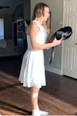 Very high quality materials and craftsmanship, at 1/3 of the price you'd expect. Fit perfectly for 13 year old for confirmation. Very elegant style. Buy this and you won't regret it, don't forget to use their sizing tool and checkout photos by other reviewers with similar bodies. It was not nearly as short at the thigh like the model shown. Sorry our photos are not excellent, she's 13, only poses for her own selfies and she had to wear a Valero to cover shoulders for event. - Crystal C.