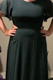 Beautiful dress! Don't hesitate about the opening in the back because it is beautiful and falls in a good spot! The slit is the right height in the skirt too. It's a smidge tight above the back opening as opposed to under the back opening that is loose! Still good though! - Erica P.