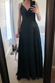 I ordered this for a wedding but returned it because it was a little bit more formal than what I was looking for. It is a beautiful dress though, I wish I had something to wear it to. The material is high quality and feels great. There did seem to be some extra fabric that stuck out from the sides of the bust towards my armpits, but it didn't look weird. The slit begins all the way up at the waist seam, but the fabric overlaps quite a bit so there isn't too much risk of a wardrobe malfunction unless you have an extra wild night. If you open up the slit too much you could show all the way up past your belly button. The dress is also pretty long, I'm 5'7" and could either wear heels with this dress or get it hemmed. The waist is high enough that I was able to try this on comfortably at 20 weeks pregnant without it being too constricting. - Julie S.