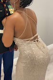I loved this dress! It fit perfectly, I was skeptical at first because I was searching for a silver gown and found this one instead. I didn't think I would like it but as soon as I tried it on I fell in love. The material was soft, it wasn't too long, and it fit like a glove. Make sure you keep the strings in the back tied tight. - ASHLEIGH H.