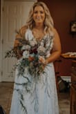 I ordered this dress on a whim! We planned our wedding in a week! I paid for expedited shipping to have it here ASAP! It showed up in 3 days! I read other reviews that said it runs large, so I decided to order an XL and it for perfectly! Still a smidge big, but not loose! And the adjustable straps are a major plus! I got so many compliments on this dress! The material is such good quality! So so pleased with this purchase! - Ashley F.