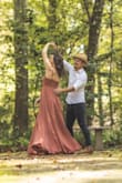 I wore this dress for my engagement photos and I just loved it.
It has adjustable straps so you can see how it'll better fit your breasts. Also, if you adjust it right you don't have to worry about moving and it getting loose and showing your breast, you can move all you want and it'll stay in place!
You also don't need a bra and you don't have to worry about showing anything - it has more than one layer of cloth so it's not transparent at all.
But it is not because of it that the dress is heavy and uncomfortable, on the contrary, it is a very comfortable dress, it moves beautifully when you walk.
It's very easy to put on and take off, no struggles to zip on unzip.
I washed it in the washing machine in cold water and in the delicate cycle, then I hang it up to dry without a problem. It's a high quality fabric.
I am 5ft5 and 120lbs, got a size small and it fit perfectly, the dress arrived on time and I didn't have to do any alterations.
I would definitely recommend this perfect dress. - Nathalia C.